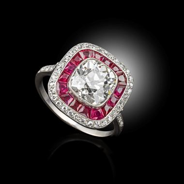 A rare art deco Diamond ring, surrounded by rubies and diamonds